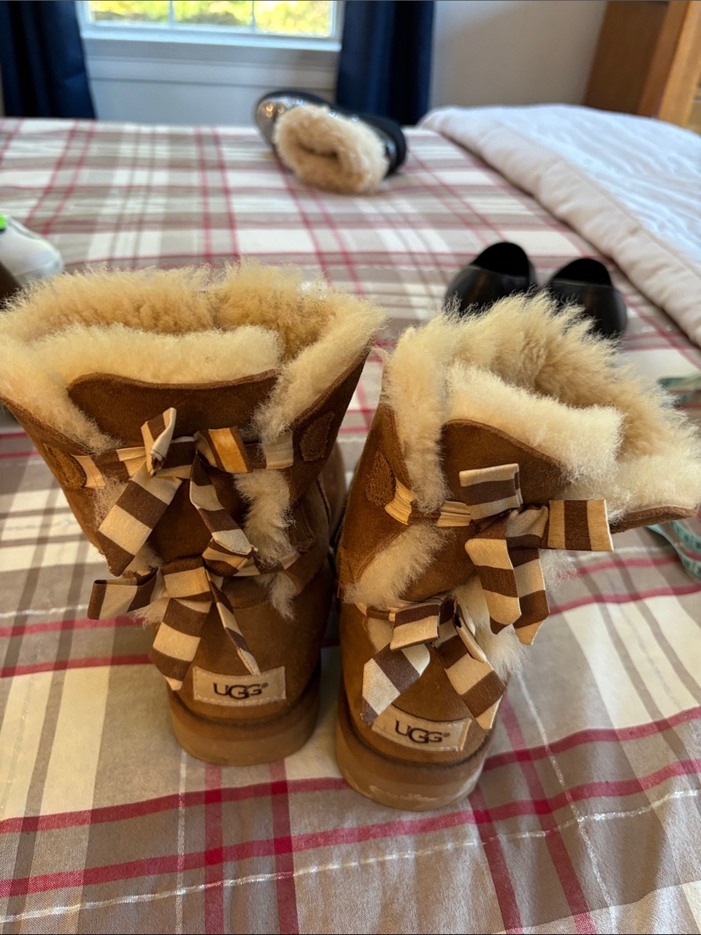 UGG women’s Chestnut Suede Boots with Shearling and Striped Bows